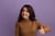 smiling-young-beautiful-girl-wearing-brown-turtleneck-sweater-showing-thumb-up-isolated-purple-wall