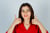 young-lady-red-blouse-showing-thumbs-up-looking-glad